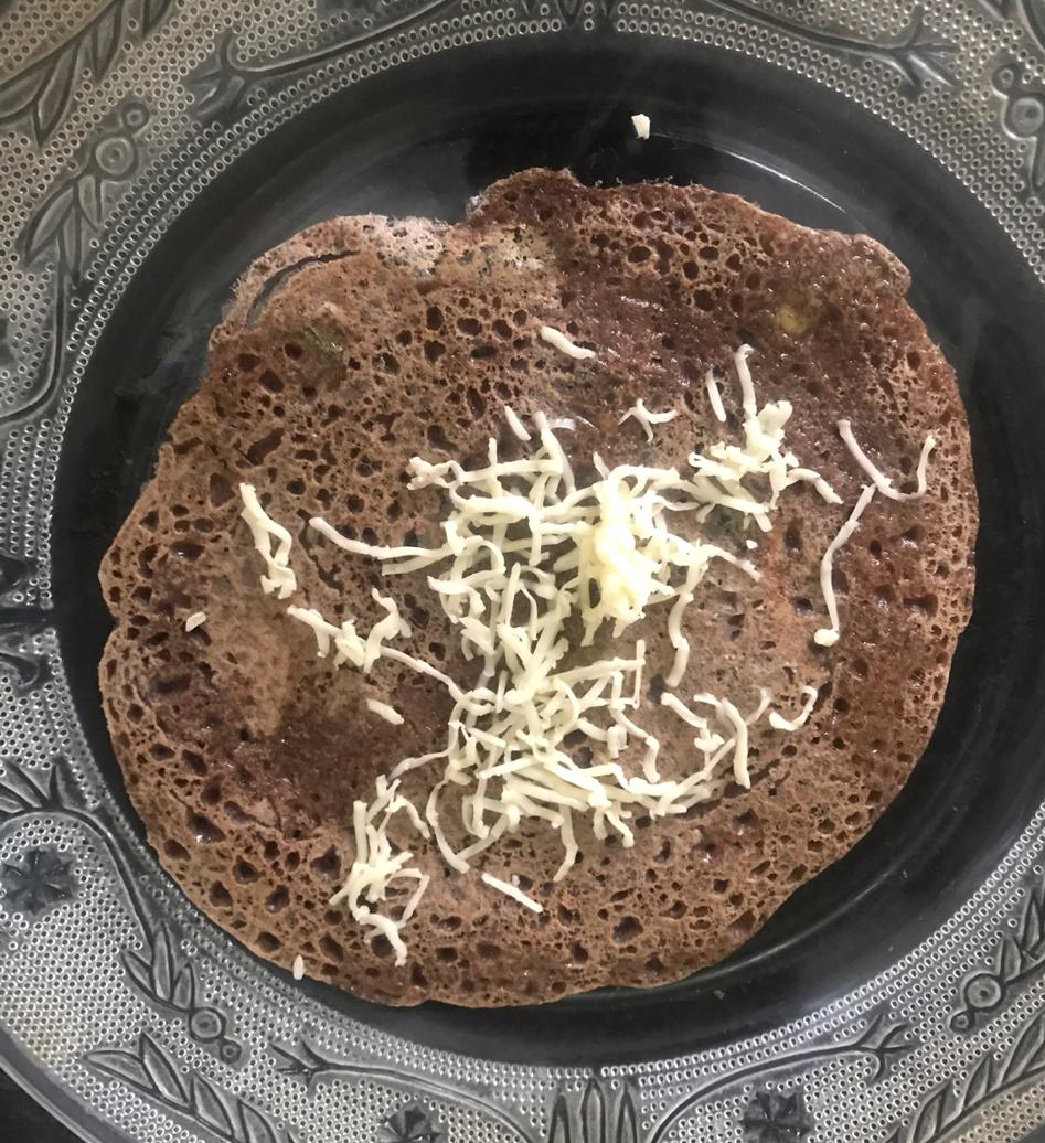 Ragi pancake with cheese shavings 